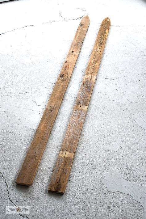 Learn how to make DIY wood ski decor with reclaimed wood planks! Includes how to stripe and finish the skis so they resemble real antique skis! Visit full tutorial with lots of pictures. Antique Skis On Wall, Diy Wood Sled, Old Skis Decor, Wooden Skis Decor, Reclaimed Wood Christmas Decor, Ski Christmas Decor, Skiing Decor, Vintage Ski Decor, Ski Cabin Decor