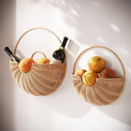 Infuse your space with the warm ambiance of the Baya Boho Basket Farmhouse Rattan Wall Art Set. These two round bamboo baskets, in tan shades, embody the heart of boho design - natural, effortless, and versatile. While they stand out as unique wall art pieces, they also offer the practicality of storage. Whether it's in the living room, bedroom, or hallway, they introduce a serene yet functional element, encapsulating the essence of boho chic. Their simple design and natural material make them a timeless addition, harmonizing seamlessly with both contemporary and traditional interiors. Size: 16.5" H x 16.5" W x 5.5" D.  Color: Brown. Rattan Wall Art, Boho Wall Basket Decor, Rattan Wall Decor, Boho Farmhouse Decor, Boho Basket, Hanging Fruit Baskets, Rattan Wall, Basket Wall Art, Hallway Art