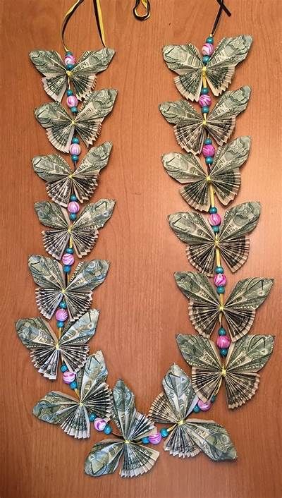 Butterfly money lei with beads Butterfly Lei Dollar Bills, Money Leis For Graduation Diy, Money Leis For Graduation, Money Crowns, Folded Butterfly, Butterfly Money, Lei Diy, Graduation Leis Diy Ribbons, Candy Leis