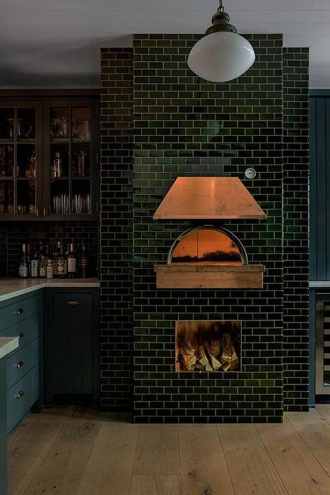 A black subway tiled pizza oven is finished with a copper hood. Indoor Pizza Oven, Outdoor Pizza Oven Kits, Pizza Oven Fireplace, Black Subway Tiles, Oven Fireplace, Wood Burning Pizza Oven, Copper Hood, Brick Oven Pizza, Brick Pizza Oven