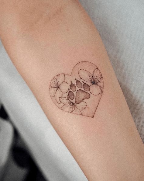 65 Meaningful Paw Print Tattoos for Pet Lovers - The Beauty Pursuit Dog In Heart Tattoo, Paw Print In Heart Tattoo, Floral Dog Paw Tattoo, Fine Line Dog Paw Print Tattoo, Flower Paw Print Tattoo, Pets Tattoo Ideas, Cat Paw Tattoos, Dog Memorial Tattoos, Pawprint Tattoo