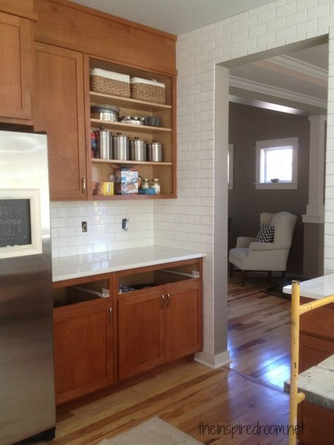 Trying to make our kitchen work without painting the cabinets - this kitchen has similar cabinetry to ours, with light quartz counters, & white subway tile backsplash