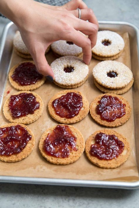 Linzer Cookies - The Little Epicurean Hazelnut Linzer Cookies, Linzer Torte Cookies, Raspberry Jam Cookies, Hazelnut Shortbread, Austrian Desserts, Linzer Cookie, Homemade Raspberry Jam, Cookie Sandwiches, Easy Christmas Cookie Recipes