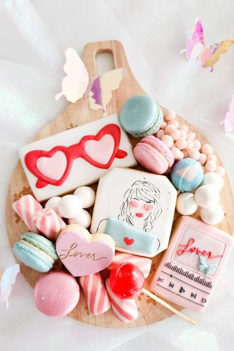 Serve up a batch of Lover-inspired cookies, featuring a mix of vibrant colors, hearts, and symbols that encapsulate the essence of Taylor Swift's Lover era. These sweet treats will be a hit with Swifties of all ages. Taylor Swift Treats, Lover Taylor Swift Party, Lover Birthday Party, Taylor Swift Party Ideas, Themed Tea Party, Ticket Party Invitations, Taylor Swift Birthday Party Ideas, Iridescent Foil, Taylor Swift Party