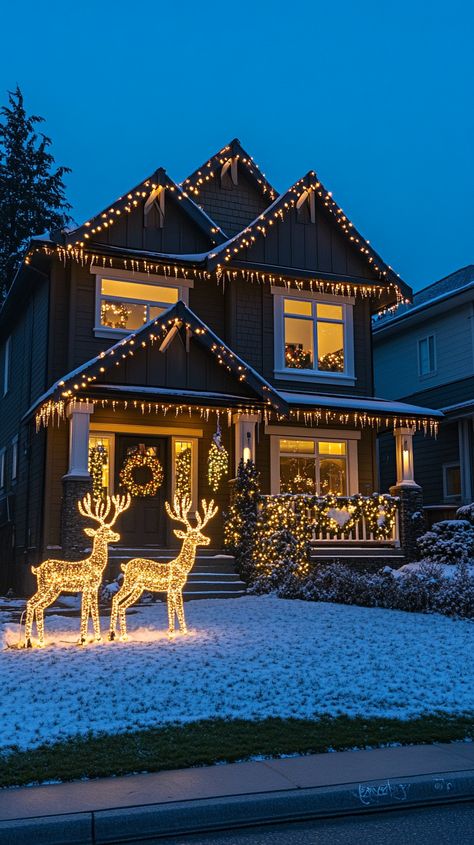 Two-story house adorned with warm white Christmas lights shaped like reindeer, surrounded by snow-covered lawns at night. Christmas Lights Outline House, Outdoor Christmas Lights Uk, Holiday Lights Outdoor House, Christmas House Lights Outdoor Ideas, Outside Christmas Lights House, Christmas Decor Ideas Lights, Classy Christmas Lights On House, New Years Home Decor, Chritmas Lights