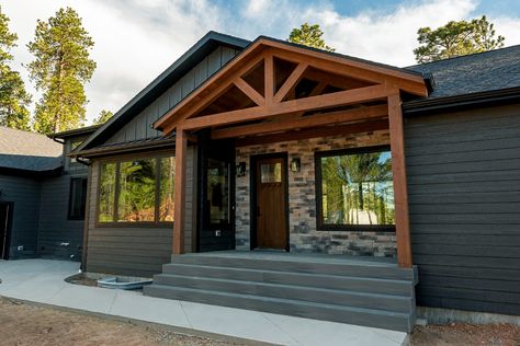 Mix and match materials for an elegant, uspcale look. This home in Grand Lake features a combination of engineered wood and stone siding. Diamond Kote Siding, Frisco Colorado, Greek Revival Home, Scottish Homes, Vertical Siding, Stone And Wood, Lap Siding, Siding Colors, Stone Siding