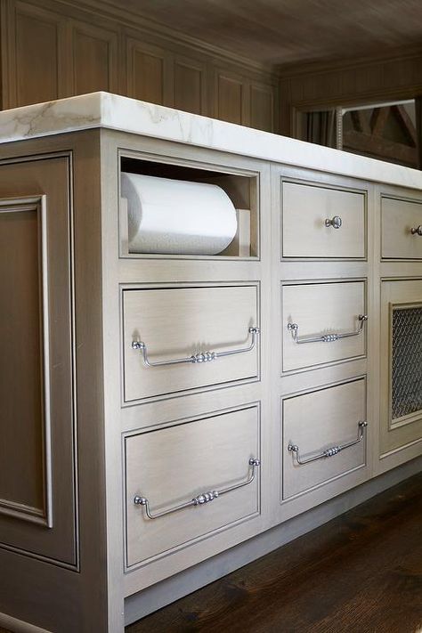 Topped with a marble countertop, this gorgeous rift saw oak kitchen island is completed with flat face drawers adorning satin nickel hardware and fitted with a paper towel dispenser. Thick Countertop, Drawer Paper, Kitchen Island Storage, Kitchen Cabinet Accessories, Kitchen Island With Sink, Unique Kitchen Design, Paper Towel Holders, Towel Holders, Kitchen Paper Towel