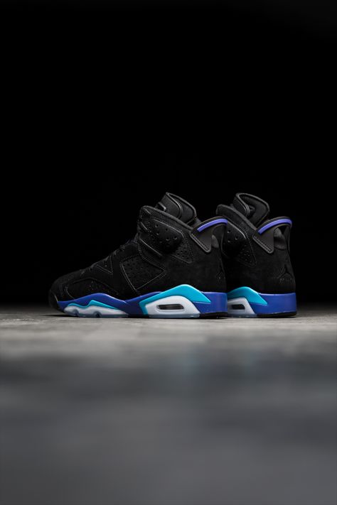 The latest Jordan silhouette to don the fan-favorite 'Aqua' color scheme is 1991's Air Jordan 6. The upper is composed entirely of black suede that sits underneath a similarly colored leather tongue, all offset by blue and purple accents on the midsole, heel, and laces. Underfoot, a semi-translucent rubber outsole completes the look.⁠ Jordan Silhouette, Aqua Color Schemes, Latest Jordans, Blue Jordans, Purple Accents, Air Jordan 6, Jordan 6, Blue Sneakers, 2024 Vision