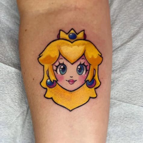 Princess Peach Tattoos - Body Artifact Princess Peach Crown Tattoo, Princess Peach Tattoo Black And White, Princess Peach Tattoo Ideas, Princess Peach Pumpkin Painting, Princess Peach Face Paint, Princess Peach Tattoo, Peach Tattoo, Mario Tattoo, Stained Glass Tattoo