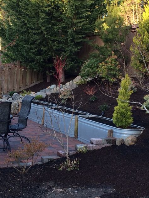 Water trough retaining wall I will use for bulbs, veggies and herbs. Install was a breeze! Perfect retaining wall! Galvanized Trough, Water Barrel, Water Trough, Garden Tub, Retaining Wall, Backyard Design, Garden Bridge, Outdoor Spaces, Yard