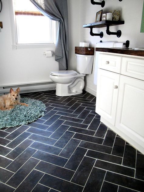 When you’re SO over your old bathroom floor, this might be the most inexpensive way to dramatically transform it (without replacing it!) Lantai Vinil, Makeover Kamar Mandi, Cheap Flooring, Peel And Stick Floor, Luxury Vinyl Tile Flooring, Vinyl Tile Flooring, Herringbone Floor, Bathroom Tile Designs, Bamboo Flooring