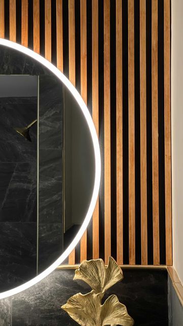 Bathroom Vanity Feature Wall, Black And Walnut Bathroom, Slat Wall Bathroom Vanity, Wood Slate Accent Wall Bathroom, Wood Behind Bathroom Mirror, Wood Slat Bathroom Ceiling, Wood And Black Bathroom Ideas, Black Bathroom Vanity With Wood Top, Wood Slats Bathroom Wall