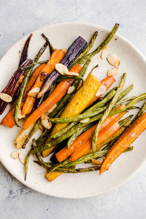 This easy Roasted Carrots and Green Beans recipes is a simple side dish and the perfect accompaniment to a meal or your holiday table. Roasted Carrots And Green Beans, Green Beans Recipes, Easy Roasted Carrots, Sweet Potato Soup Vegan, Easter Sides, Gluten Free Thanksgiving Recipes, Beans Recipes, Green Beans Recipe, Carrots And Green Beans