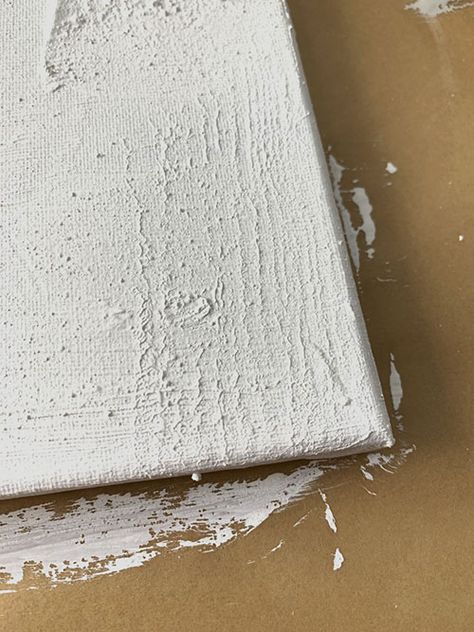 Textured DIY Easy Canvas Painting - The Honeycomb Home Diy White Artwork, How To Create Textured Canvas Art, Baking Soda Paint Canvas, Concrete Canvas Art Diy, Plaster Painting On Canvas Diy, Paint Over Canvas Painting, Large Canvas Painting Ideas Diy Art, Diy Home Art Canvas, Diy Painting Canvas Easy Wall Decor