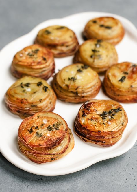 Crispy Potato Stacks with Garlic Herb Butter — saltnpepperhere Garlic Herb Butter Potato Stacks, Potatoe Stacks With Garlic Herb Butter, Garlic Potato Stacks Plant You, Salt And Pepper Potatoes, Crispy Potato Stacks With Garlic Herb Butter, Potato Stackers Recipe, Crispy Potato Stacks Muffin Tins, Potato Stacks With Garlic Herb Butter, Stacked Potatoes In Muffin Tin