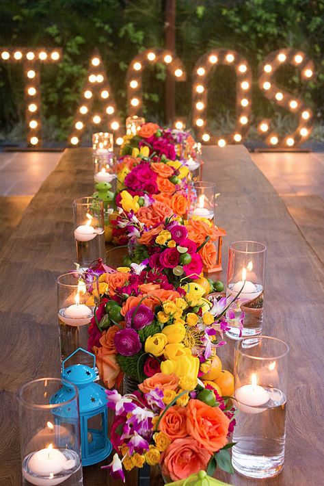 wedding taco bar on a long table bright flowers and candles on the background inscription tacos with light bulbs bohemiadelmar Taco Bar Wedding, Floral Themed Wedding, Mexican Themed Weddings, Bright Wedding Flowers, Mexican Fiesta Party, Fiesta Wedding, Tafel Decor, Mexican Party Theme, Fiesta Theme