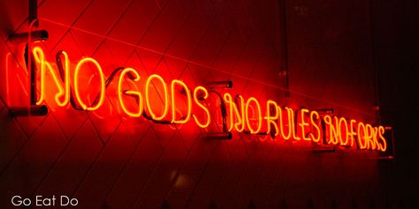 Saying it in a capital way. A neon light says 'No Gods, No Rules, No Forks' at the Pizza Punks restaurant in Newcastle, England. Punk Restaurant, Newcastle England, No Rules, Graffiti Styles, Office Kitchen, Forks, Newcastle, Pizza, England