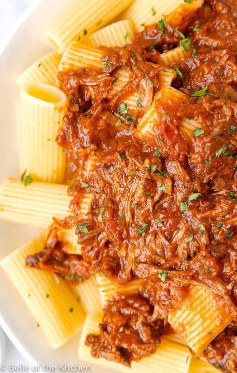 This incredibly delicious Beef Ragu is braised in the slow cooker for the ultimate cozy meal. The tender, rich beef is slow cooked with tomatoes, herbs, and red wine, then served over hearty noodles for a restaurant-worthy dinner made at home. #beef #ragu #dinner #crockpot belleofthekitchen.com Crockpot Ragu Braised Beef, Slow Cooker Beef Ragu 12 Tomatoes, Braised Beef Recipes Slow Cooker, Beef Ragu Slow Cooker, Shredded Beef Ragu, Slow Cooker Lasagne, Spaghetti Sauces, Beef Ragu Recipe, Beef Rump Roast