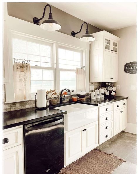 35 Over Kitchen Sink Lighting Ideas That Go Beyond Pot Lights Over Kitchen Sink Lighting Ideas, Distressed Kitchen Island, Light Above Kitchen Sink, Black Kitchen Knobs, Over Kitchen Sink Lighting, Kitchen Sink Lighting Ideas, White Farmhouse Kitchen, Over Kitchen Sink, Above Kitchen Sink