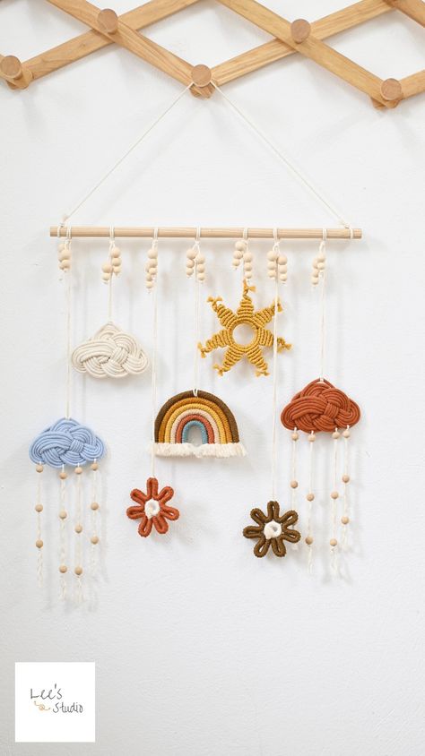 🌨️ This macrame model is designed to add a whimsical touch to any child's room. Hanging clouds, rainbows, and raindrops create a dreamy atmosphere that children will love.  🌈The addition of the moon and stars completes the celestial theme, making it perfect for bedtime stories and sweet dreams.   Details: - Material: Handmade with cotton braided cord, excellent quality - Approximate dimensions: Our wall hanging art measures 18 inches wide and 21 inches high  Style: Style A: coming with   one owl, one halfmoon, four stars, one cloud Style B: coming with one rainbow, one sun, two flower, three could I do custom color for each item, message me for the colors you love 🌈☘Please note that: - Knots can get a little tweaked in shipping, these can be easily straightened out when you hang it - Th Macrame Kids Room, Night Sky Wall, Macrame Nursery, Art Macramé, Simpul Makrame, Sky Wall Art, Macrame Baby, Neutral Baby Gifts, After The Rain