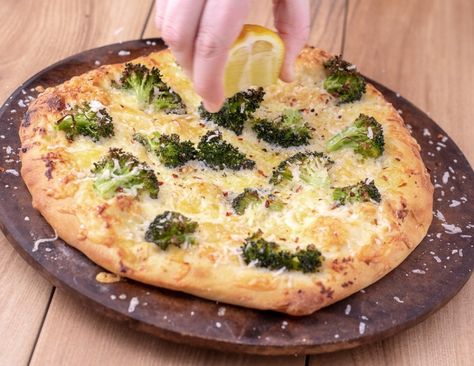 Lemon and broccoli white pizza uses olive oil, garlic and cheese as it’s base. The acidity from the lemon juice really brightens up this cheesy pizza without being overly lemony. The three cheese combination gives you a melty but flavorful base with crunchy broccoli. Brocolli Pizza, Lemon Chicken Broccoli, Crunchy Broccoli, Broccoli Pizza, Cheesy Pizza, Olive Oil Garlic, White Pizza, Pizza Ingredients, Vegetarian Pizza