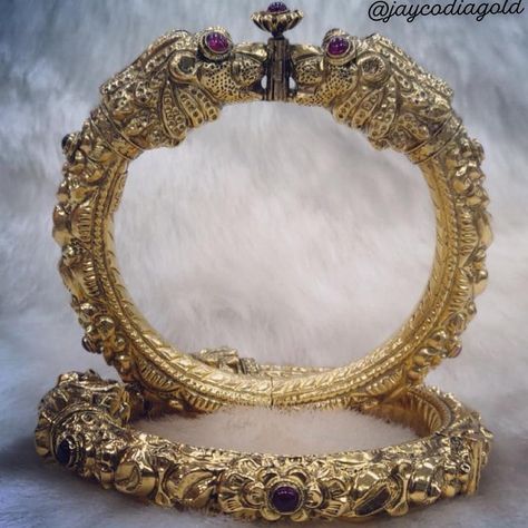 Royalty is the lion that roar from your every speck. This is what your jewellery should also demonstrate.  .  Own these gold lion kangan with rubies only from jayco diagold jewels.  . #jewelleryaddict #bangles #goldbangles #royaljewellery #jewellery #gold #ruby #handcrafted #handcraftedjewellery #puregold Kada Design For Women, Bangles Gold Design, Kada Bangles Gold Design, Gold Kada Design For Women, Gold Kada Design, Indian Contemporary Art, Bridal Sarees South Indian, Gold Lion, Bridal Sarees