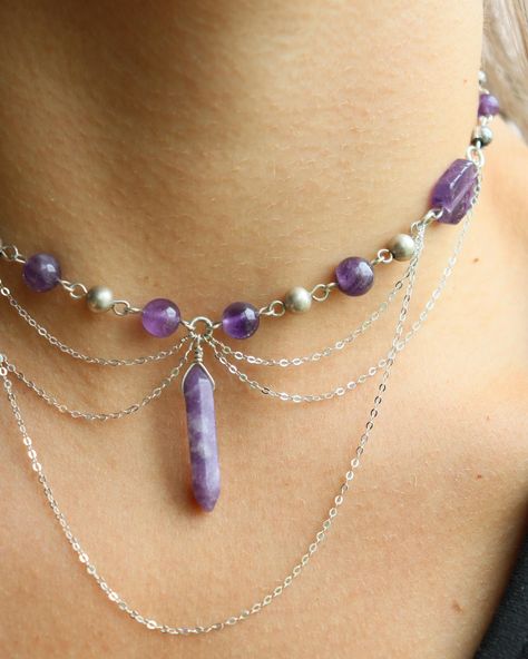 amethyst x lepidolite sterling choker This baby has more chain than most my other chokers, just experimenting with their placement and what not ⛓️ she features amethyst beads in various forms, and a lepidolite crystal dangling in the center, all made with sterling wire! You can find her listed on my website with a few other chokers uploaded recently!🫶🏼 • • • • • • #crystaljewelry #wirewrapping #wirewrap #wirejewelry #wirewrappedjewelry #silverjewelry #silverwirejewelry #handmadechoker #ear... Beaded Wedding Jewelry, Silver Wire Jewelry, Lepidolite Crystals, Crystal Bead Jewelry, Handmade Chokers, Diy Jewelry Projects, Diy Jewelry Necklace, Beaded Wedding, Amethyst Beads