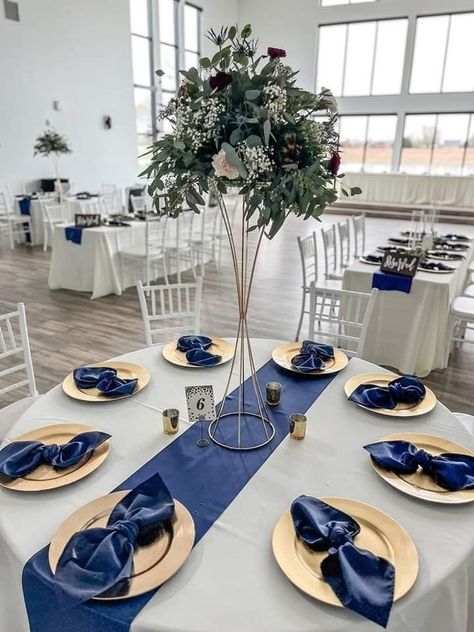 Tall Graduation Centerpieces, Navy Table Centerpieces, Dark Blue Wedding Centerpieces, Champagne Gold And Blue Wedding, Navy Blue White And Gold Centerpieces, Royal Blue Quince Table Decor, Dark Blue Wedding Decorations, Navy And Silver Wedding Theme, Navy Blue Centerpieces Quinceanera