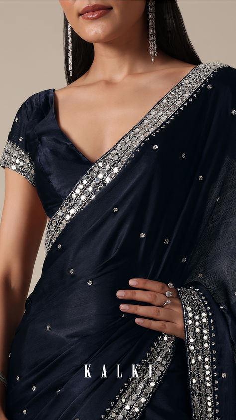 "Indulge in sophistication with this Royal Blue Satin Chinnon Saree. The stones delicately embellish the fabric, creating a luxurious and timeless appeal. The deep blue and navy tones enhance the richness of the saree, making it a perfect choice for party wear. Meticulous detailing and the inclusion of unstitched blouse fabric ensure a personalized fit. " Dark Blue Saree, Chinnon Saree, Royal Blue Saree, Vintage Core, Bridesmaid Saree, Kalki Fashion, Prom Inspo, Fancy Sarees Party Wear, Satin Saree