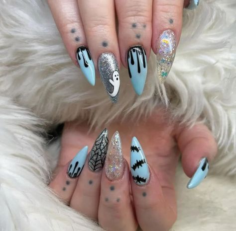 40 halloween nail ideas for the 2024 spooky season you're actually gonna like 25 Royal Blue Halloween Nails, Baby Blue Halloween Nails, Halloween Blue Nails, Teal Halloween Nails, Light Blue Halloween Nails, Blue Spooky Nails, Dark Blue Halloween Nails, Cartoon Halloween Nails, Halloween Nails Blue