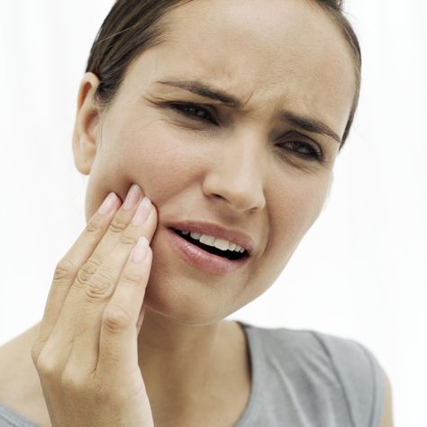 close-up of a young woman holding her cheek in pain Tooth Extraction Aftercare, Tooth Extraction Healing, Tooth Ache Relief, Hydrogen Peroxide Uses, Remedies For Tooth Ache, Mouth Rinse, Wisdom Teeth Removal, Tooth Pain, Teeth Health