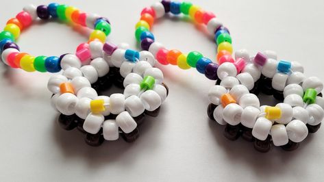 This kandi bracelet is made with rainbow, white beads, and cute charm. Includes 1 kandi bracelet Size 7 inches This item is premade and is ready to ship! Perfect for any event! You will get lots of compliments in this unique wearable art! Stand out at your next event! Birthday party Edm festival Raves Rave outfit Festival outfit Pride Rave birthday Rave gift Rave anniversary Kidcore Bracelets, Bracelet Kidcore, Kandi Kid Outfit, Kidcore Bracelet, Kawaii Bracelets, Bracelets Kawaii, Rave Birthday, Rave Kandi Ideas, Outfit Edc