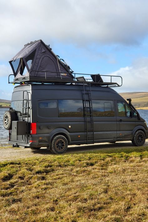 This is van life at its finest: MAN TGE 4x4 campervan, equipped with a bespoke roof rack, TentBox, external storage box, and built-in sun loungers on the roof deck.   This is 'The Lion', a custom van conversion build which sleeps and seats 5. The exterior is hot property, but the interior is as cool as a luxury ski chalet in The Alps.  If you dream of exploring in style and comfort, pin this as your ultimate camper van inspiration! Vw Vans Camper, Camper Van Roof Bed, Campervan For 4, Van Roof Ideas, Camper Van Roof Deck, Van Roof Deck, Campervan Exterior, Mini Van Camper, Luxury Camper Van