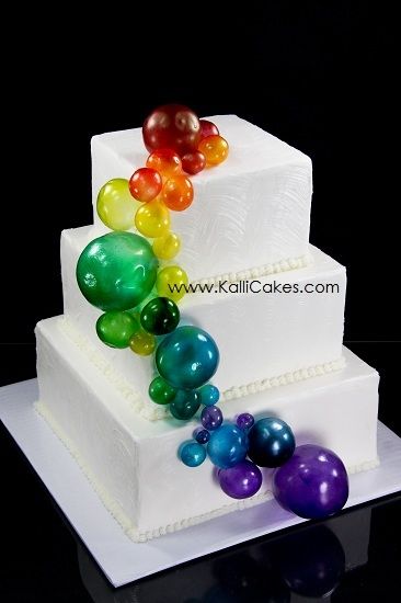 Gelatin bubbles which have been airbrushed adorn this buttercream textured cake. Gelatine Bubbles, How To Make Gelatin, Gelatin Bubbles, Super Torte, Bubble Cake, Rainbow Bubbles, Torte Cupcake, Cake Decorating Tutorials, Cake Tutorial