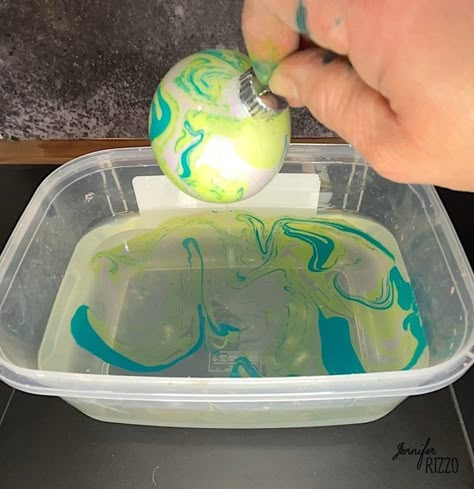 How to Make Marbled Christmas Ornaments with Paint - Jennifer Rizzo Marbled Christmas Ornaments, Marbled Ornaments, Glass Ornaments Diy, Marble Ornaments, Christmas Tree Bulbs, Clear Christmas Ornaments, Stockings Diy, Christmas Ornaments Decor, Paint Dipping