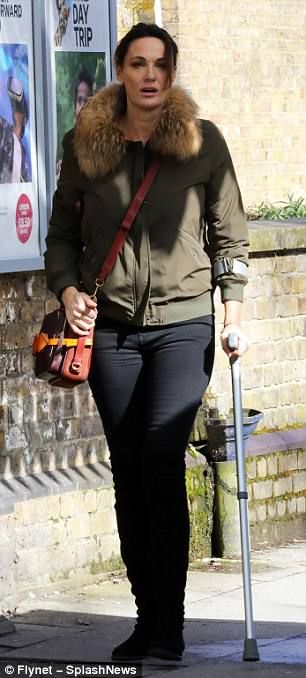 Stylish: Sarah looked effortlessly chic... Sarah Parish, Crutches, Train Station, Winchester, A Month, Leather Pants, Train, Pants, Trousers