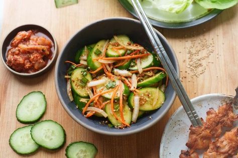 Korean Cucumber Salad Recipe (Oi Muchim) - Hungry Huy Oi Muchim, Sunomono Salad, Korean Cucumber Salad, Korean Cucumber, Vietnamese Soup, Asian Cucumber Salad, Cucumber Salad Recipe, Gluten Free Sides, Carrot Greens