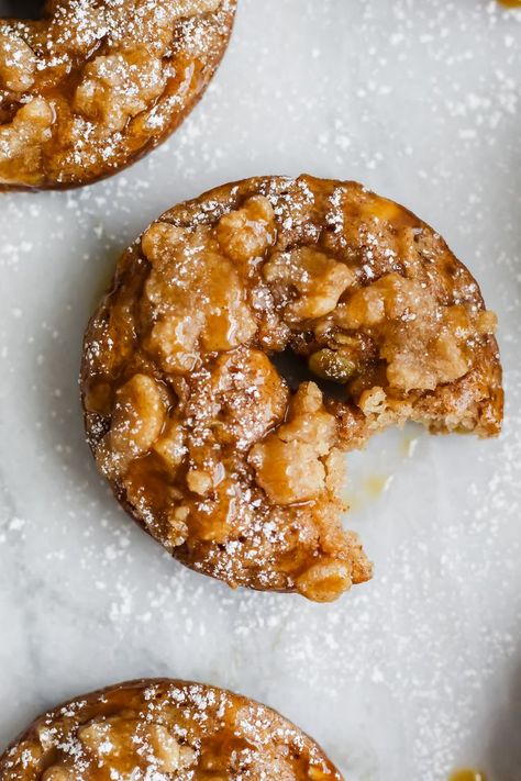 These Baked Caramel Apple Streusel Donuts are the best and easiest brunch option this Fall! Loaded with fresh apples, whole wheat flour and the most delicious streusel topping – these won’t last long in your house! #appledonuts #caramelappledonuts #caramelappledesserts #bakeddonuts Baked Caramel Apples, Caramel Apple Desserts, Apple Streusel, Baked Caramel, Homemade Doughnuts, Homemade Donuts, Doughnut Recipe, Baked Donuts, Streusel Topping