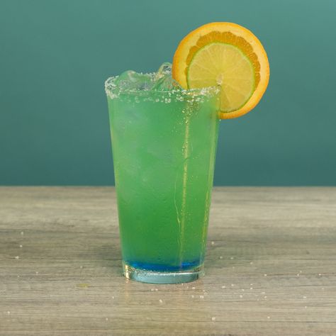 THE TOXIC B*TCH 2 1/2 oz. (75ml) Vodka 1 oz. (30ml) Tequila 1 oz. (30ml) Blue Curacao 1/2 oz. (15ml) Mango Juice 1/2 oz. (15ml) Orange Juice Lemon Lime Soda Garnish: Salt Rim/Lime Slice/Orange Slice  PREPARATION 1. Rim edge of glass with lime juice and salt. Add ice. 2. Pour over vodka, tequila, blue curaçao, mango juice and orange juice before topping with lemon lime soda. 3. Garnish with a lime slice and orange slice. DRINK RESPONSIBLY!  (User Submitted by Rylie Hart @ TipsyBartender.com) Thanksgiving Drinks Alcohol, Jolly Rancher Vodka, Vodka Mixers, Caramel Apple Martini, Lime Slice, Cherry Vodka, Liquor Recipes, Lemon-lime Soda, Thanksgiving Drinks