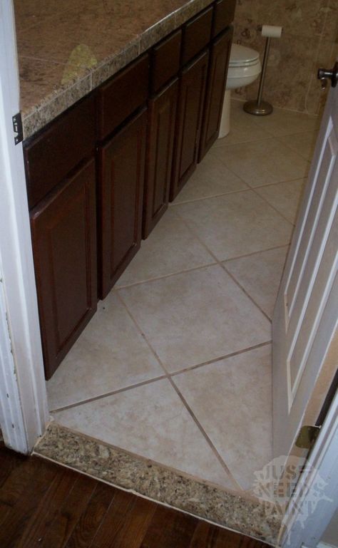 A diamond pattern adds spark into a room full of squares. Take this bathroom where pretty much everything is square: the cabinets, tile surround, bathtub, square floor plan, rectangle threshold, etc. The diamond pattern on the floor breaks it up, creating visual interest. Square Floor Tile Patterns, Square Tile Bathroom Floor, Tile Surround Bathtub, Diamond Pattern Tile Floor, Bathtub Square, Diamond Tile Floor, Vinyl Tile Flooring Bathroom, Floor Tile Patterns Layout, Tile Layout Patterns