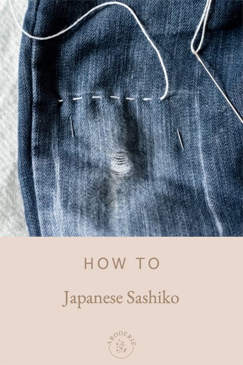 Discover how to mend your clothes with beautiful Japanese sashiko, an ancient stitch technique for darning clothes. Sashimi Mending Jeans, Sashiko Visible Mending, Japanese Mending Technique, Sashiko Mending Patterns, Sashiko On Jeans, Sashiko Mending Tutorial, Sashiko Embroidery Jeans, Japanese Mending Sashiko, Visible Mending Jeans Knees