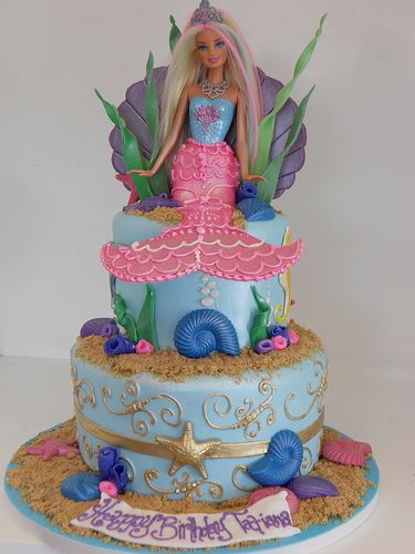 Mermaid Barbie Cake (2164)...love the gold starfish & swirl accents and shell barbie backdrop! Mermaid Barbie Cake, Barbie Mermaid, Barbie Birthday Cake, Bolo Barbie, Barbie Doll Cakes, Mermaid Birthday Cakes, Mermaid Barbie, Anniversaire Diy, Cinderella Cake