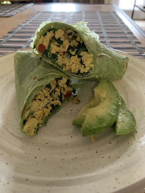 Finally tried making scrambled eggs but w/ tofu & it was super easy & super delicious  -crumble tofu, add turmeric, pepper, garlic powder, salt, soy sauce & spinach, put in wrap & top with avocado & bell peppers Veggie Wrap Aesthetic, Tofu Wraps, Scrambled Tofu Recipe, Scrambled Tofu, I Want Food, Natural Body Lotion, Protein Pasta, Tofu Stir Fry, Veggie Wraps