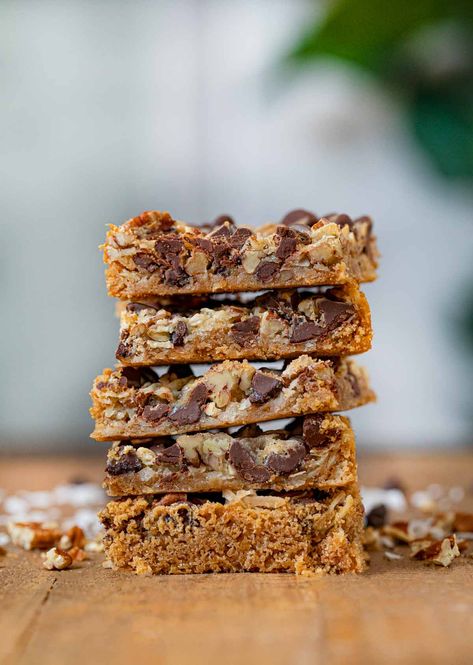 Easy Five Layer Bars are easy, gooey, sticky sweet cookie bars. A kid-friendly dessert with chocolate chips, coconut, pecans and a graham cracker crust. Dessert With Chocolate Chips, Chocolate Chip Cookie Bar, Vegan Sweetened Condensed Milk, Dessert With Chocolate, Chocolate Chip Cookie Bar Recipe, Homemade Sweetened Condensed Milk, Desserts With Chocolate Chips, Kid Friendly Dessert, Layer Bars