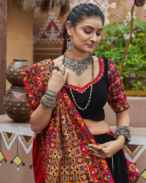 Celebrate Navratri style Rich black color with embroidery & mirror work and viscose rayon dupatta 🖤✨ SHOP NOW 🛍️ gotifab.com [lehengacholi, garba outfits, navratri lehengas, navratri collection,navratri chaniya choli,navratri collection ] #lehengacholi #navratrilehenga #navratricollection #navratri #navratrichaniyacholi #garbaoutfit Mirror Work Lehenga Choli, Garba Outfit, Black Lehenga Choli, Navratri Lehenga, Mirror Work Lehenga, Choli Dress, Mirror Work Blouse, Black Lehenga, Navratri Chaniya Choli