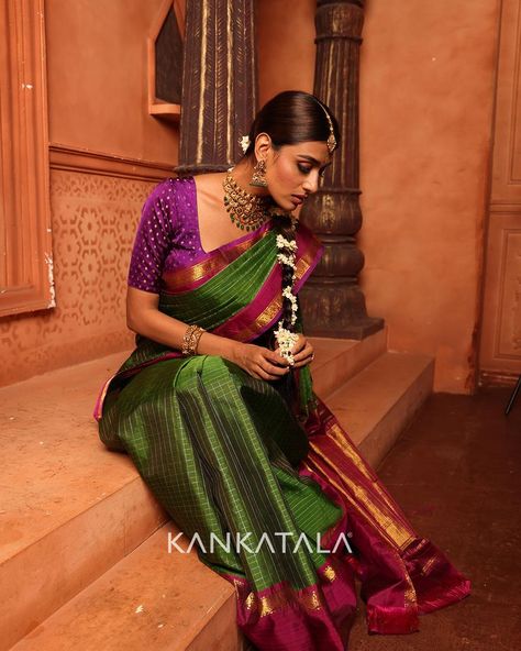 A paradigm of timeless design woven in piercing shades of green draped with gold zari checks all over the body. For a dash of regal appeal, this Vintage Kanchipuram Green Saree is adorned with a striking contrast of the rettai pettu border (double border) that serves as a reminder to cherish its impeccable weave by carrying forward its legacy from generations to generations.​ #vintagecollection #kankatalakanchipuram #kanchipuramsarees #kanchipuramsilk #vintagesaree #vintagekanchipuram Green Drapes, Half Saree Designs, Green Saree, Elegant Saree, Kanchipuram Saree, Half Saree, Pure Silk Sarees, The Body, Saree Designs