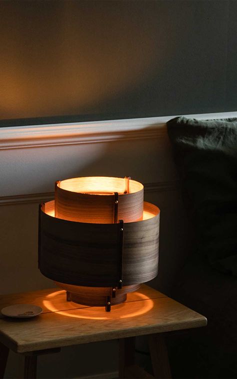 With a blend of Scandinavian and Art Deco aesthetics, use this wooden table light to brightens living spaces, bedrooms, and workspaces alike. Dark Speakeasy, Comfortable Bedroom Decor, Tom Raffield, Wood Ceiling Lamp, Table Top Lamps, Copper Design, Wooden Table Lamps, Home Decor Ideas Living Room, Wooden Light