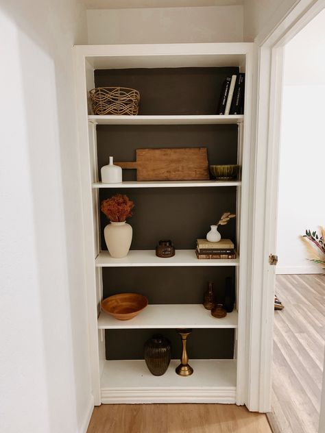 Hallway, bookshelf styling, bookshelf decor ideas, black paint, neutral decor Shelves At End Of Hallway, End Of Hallway Storage, Hall Bookshelf Ideas, End Of Hallway Bookcase, End Of Hall Bookshelf, End Of Hallway Shelves, End Of Hallway Bookshelf, Backless Bookshelf, Shelf In Hallway