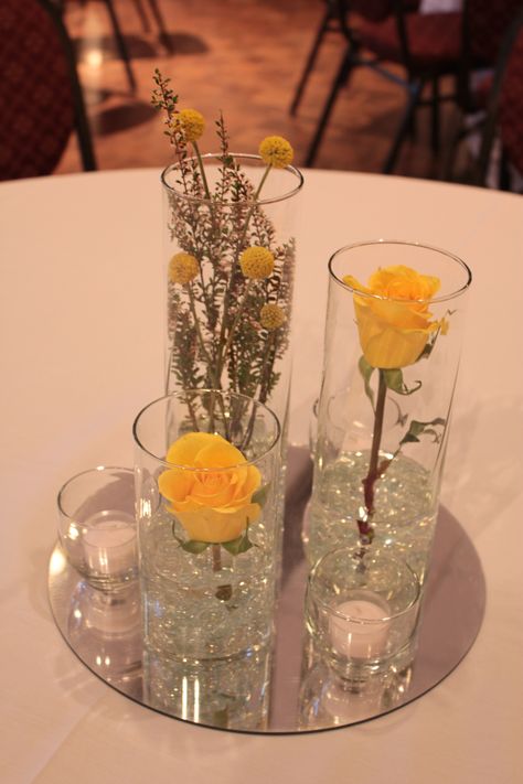 Trio of Cylinders with fresh yellow roses and billy buttons Yellow Rose Wedding, Philanthropy Events, Gala Decorations, Billy Buttons, Small Centerpieces, Rose Decor, Yellow Wedding, Greek Life, Centre Pieces