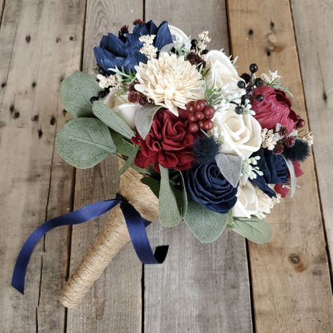 💥ALL SALES ARE FINAL💥 Wood Flower Bouquet, Navy and Burgundy Bridal Bouquet, Burgundy Wedding Bouquet, Wooden Flower Bouquet, Sola Wood Flowers Sola Wood Flowers are a perfect wedding flower alternative to fresh flowers. Our wooden bridal flowers are 100% fake and will never wilt or die. All greenery and fillers are completely artificial or dried, nothing is living. Storing the wood flowers is very easy and allows brides to purchase early and plan ahead. 🖌flower colors include cream, navy blu Bridal Bouquet Burgundy, Burgundy Wedding Bouquet, Burgundy Bridal Bouquet, Wedding Flower Alternatives, Wooden Flower Bouquet, Navy And Burgundy Wedding, Bouquet Burgundy, Navy Wedding Flowers, Western Themed Wedding